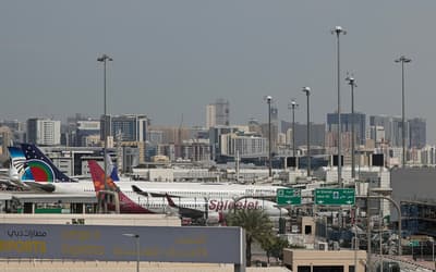 Drones fall near Dubai airport causing injuries as flights are axed